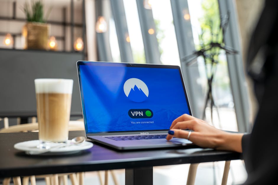 A person using a laptop with a VPN connection in a modern cafe setting, showcasing remote work and internet security.